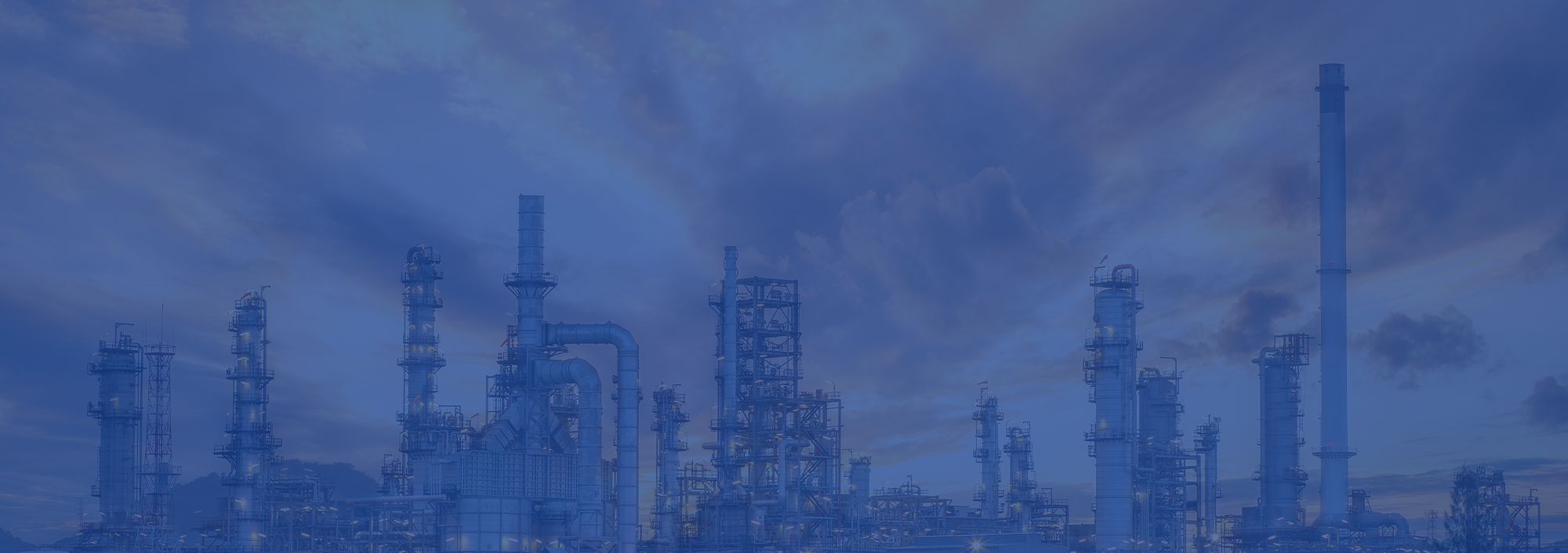 Oil and gas refinery at dusk