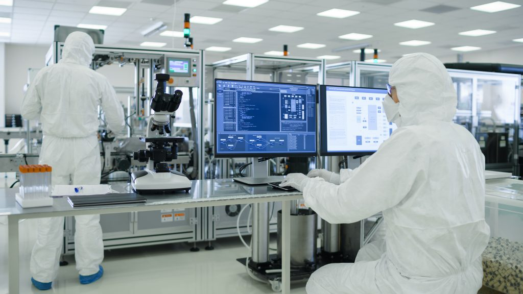 Pharmaceutical manufacturing operators monitoring production systems